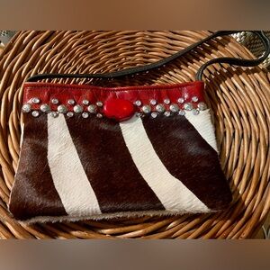 KurtMen design cowhide clutch with Red leather and crystal accents.